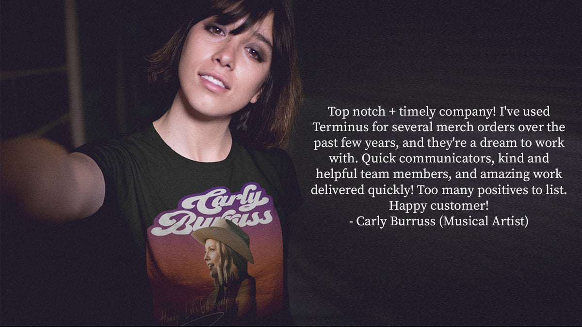 Woman wearing a band tshirt taking a selfie.